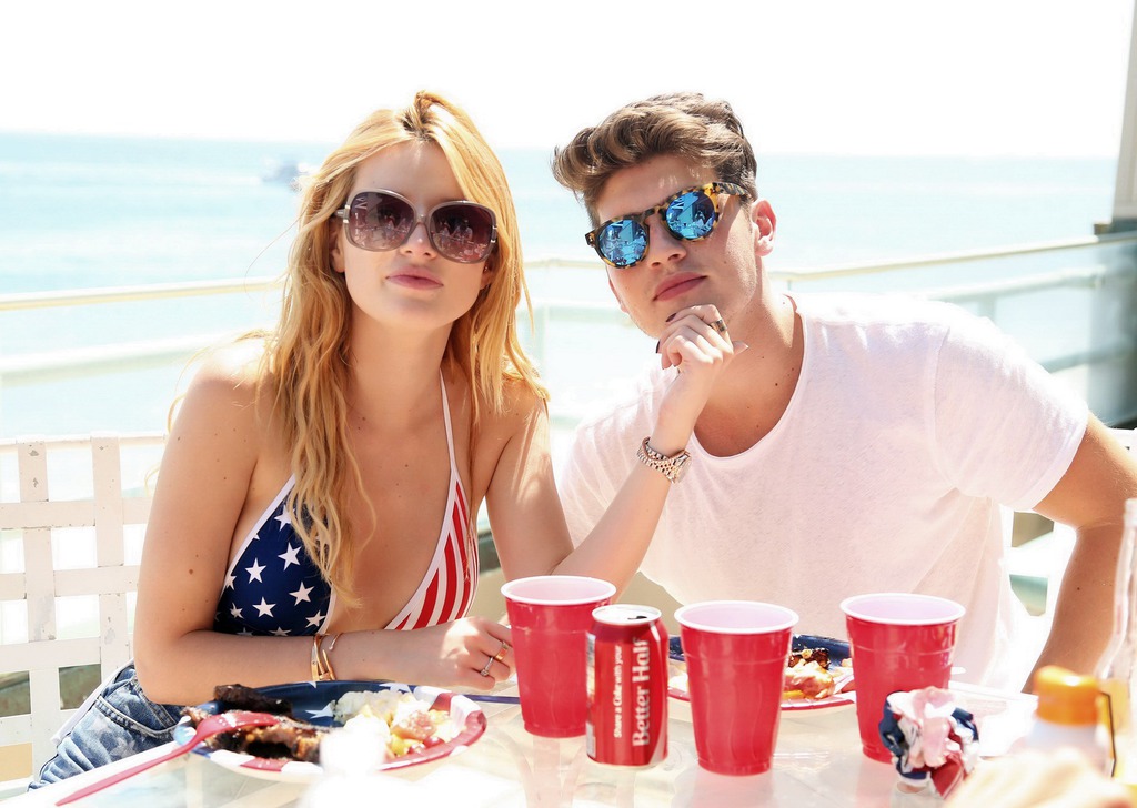 Bella Thorne In Low Cut National Colored Swimsuit 01