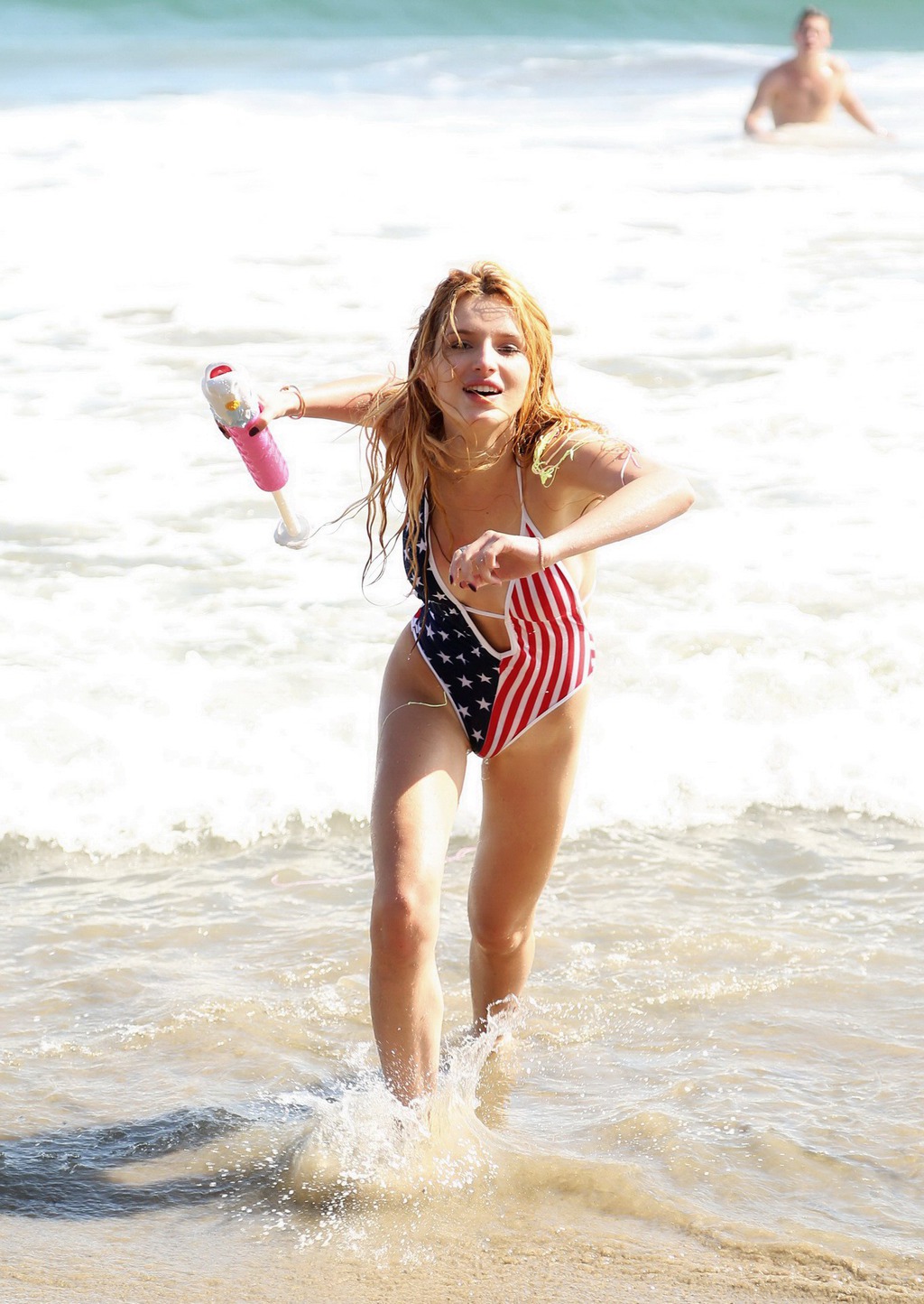 Bella Thorne In Low Cut National Colored Swimsuit 08