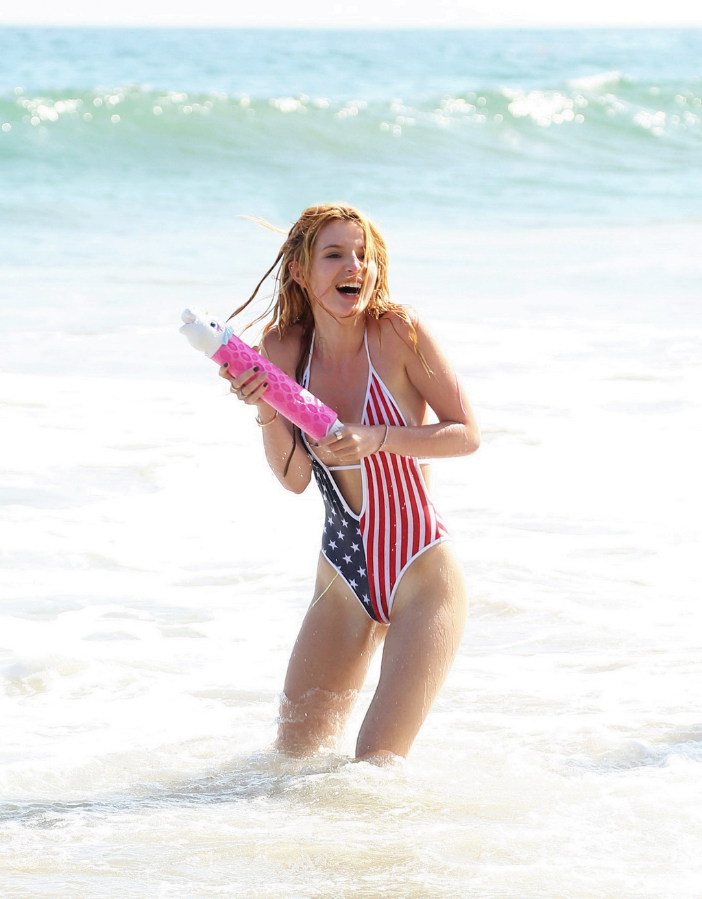 Bella Thorne In Low Cut National Colored Swimsuit 09