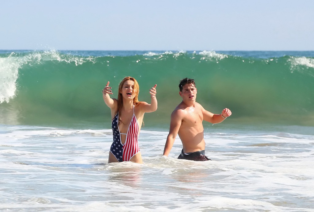 Bella Thorne In Low Cut National Colored Swimsuit 14