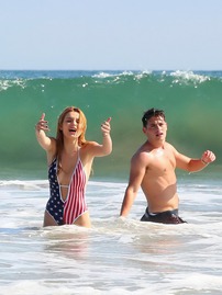 Bella Thorne In Low Cut National Colored Swimsuit