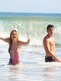 Bella Thorne In Low Cut National Colored Swimsuit